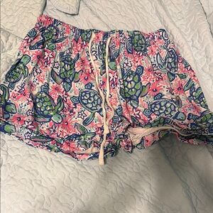 Pink and Blue Athletic Shorts with Vibrant Floral Design
